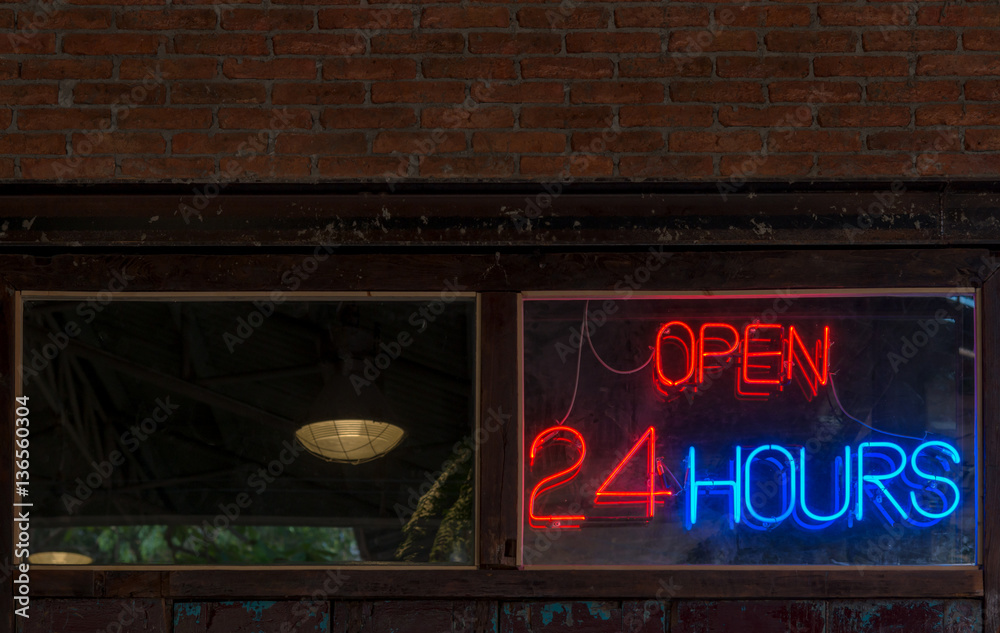 Fototapeta premium Open 24 Hours neon sign on a restaurant