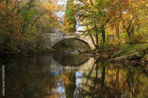 Fototapeta Naklejka Na Ścianę i Meble -  Mawddach River and Old Bridge  in Autumn Wales