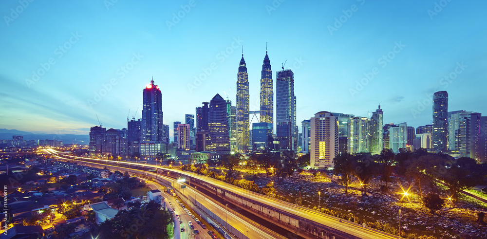 Fototapeta premium Kuala Lumpur city skyline at twilight, Malaysia .