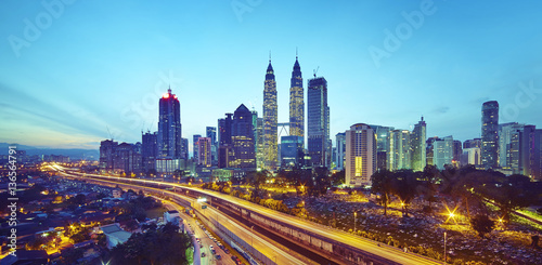 Kuala Lumpur city skyline at twilight, Malaysia .