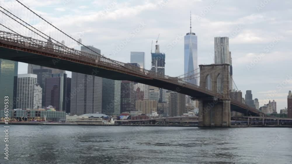 Brooklyn Bridge and New York city skyline in a cloudy afternoon Brooklyn Bridge and New York city skyline in a cloudy afternoon