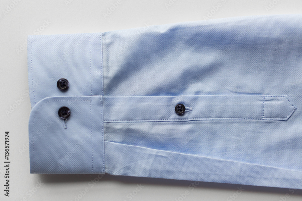 close up of blue shirt sleeve close up of blue shirt sleeve