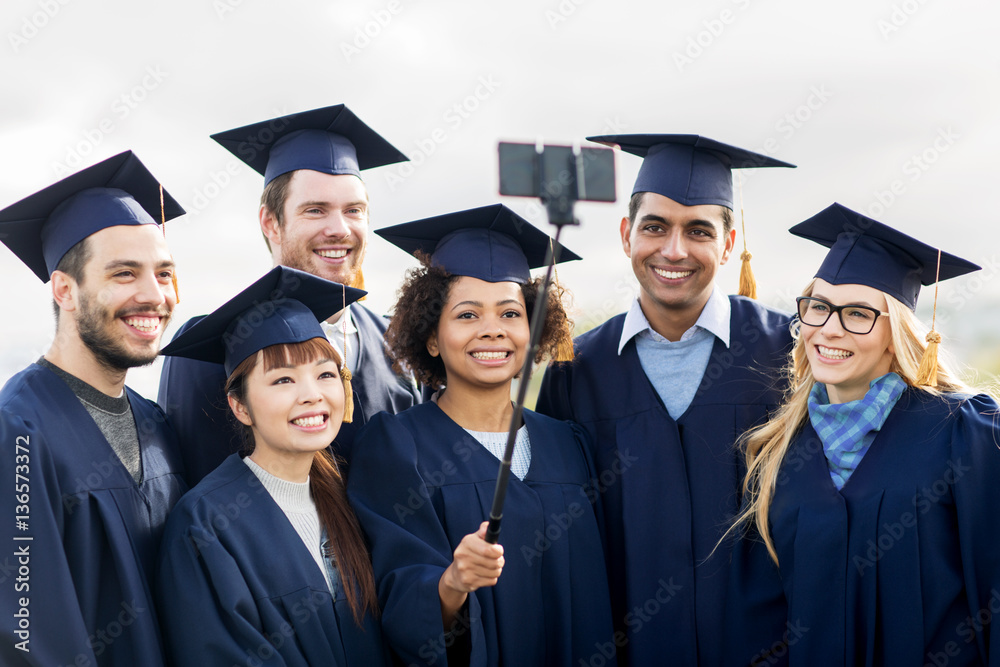 students or bachelors taking selfie by smartphone students or bachelors taking selfie by smartphone