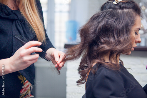 the hairdresser does a hair