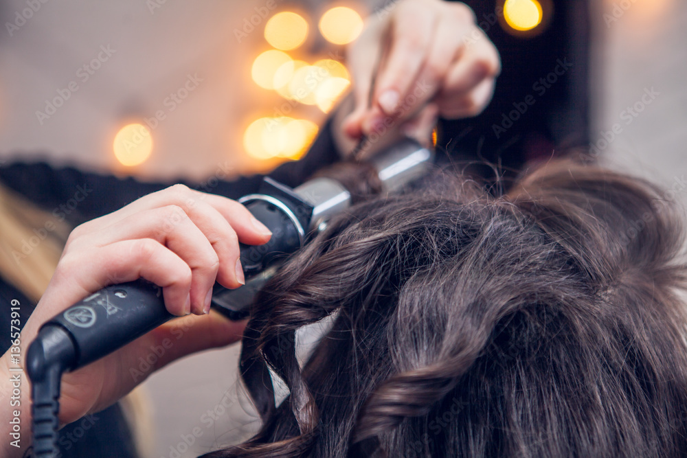 Fototapeta premium the hairdresser does a hair