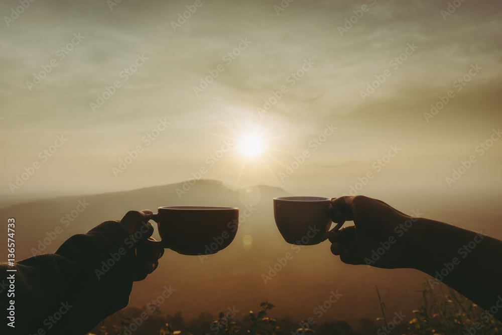Fototapeta premium young man with cup of coffee on mountain lifestyle travel concept.
