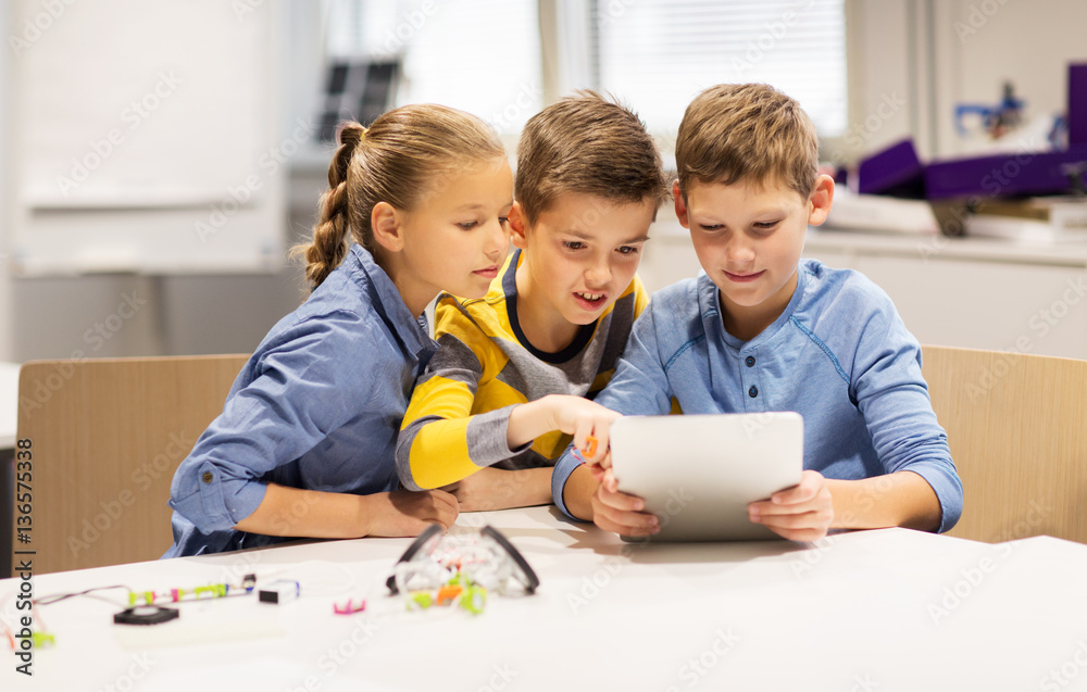 kids with tablet pc programming at robotics school kids with tablet pc programming at robotics school