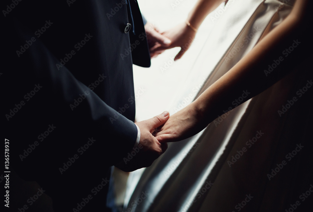 young people holding hands each other