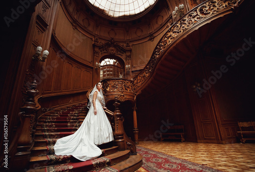 incredible bride comes down the stairs down
