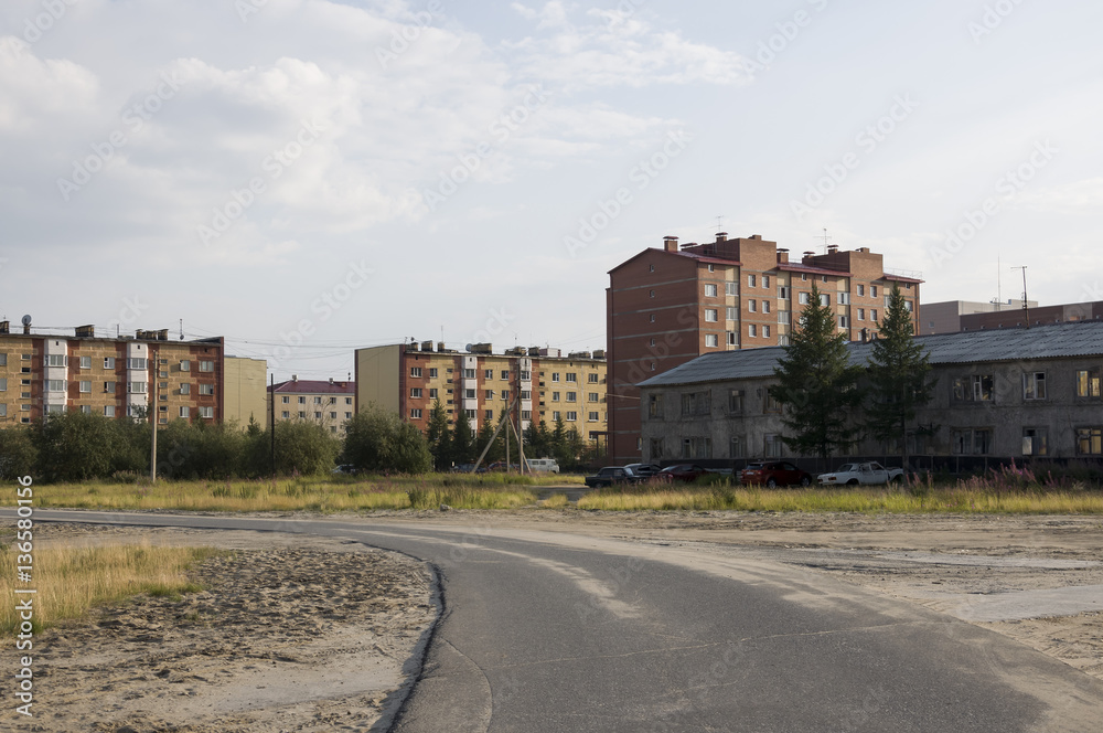 Old two-storeyed and modern many-storeyed building. Сontrast and opposite Old two-storeyed and modern many-storeyed building. Сontrast and opposite