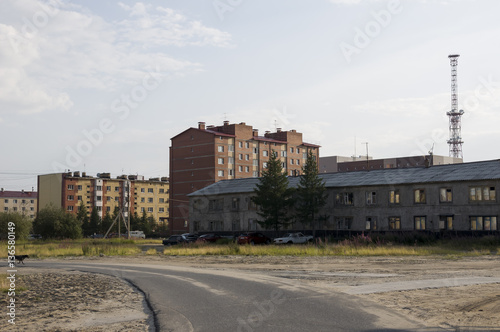 Old two-storeyed and modern many-storeyed building. Сontrast and opposite © Oksana