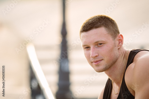 Portrait of attractive young sporty man outdoors