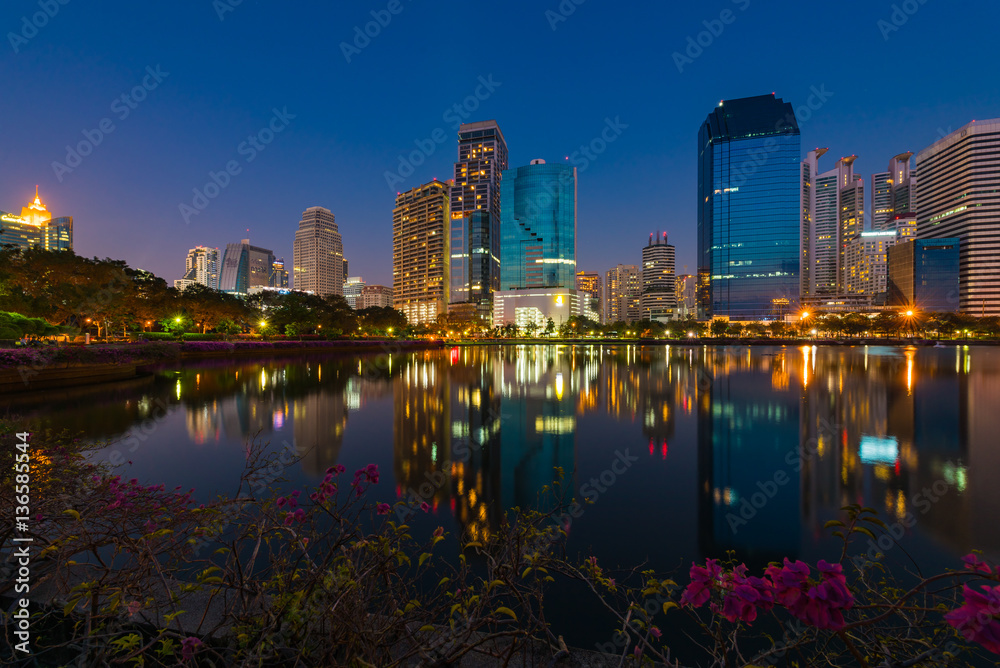 Cityscape in the evening view from Benjakiti park in Bangkok, Thailand.