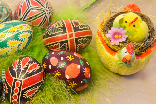 Easter basket filled with colorful eggs on a white background © OLEKSANDR