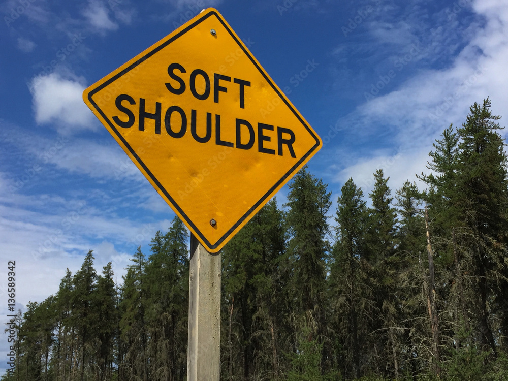 Soft Shoulder Sign Against Blue Sky