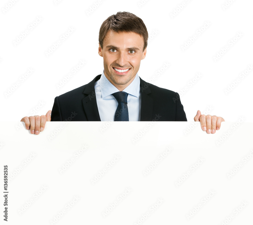businessman showing signboard with copyspase businessman showing signboard with copyspase