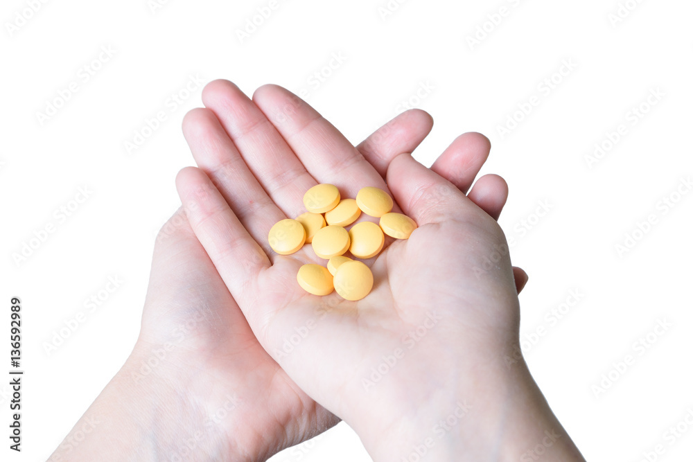 Yellow pills in hand Yellow pills in hand