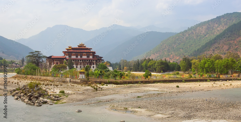 Bhutan panorama landscape. Punakha Dzong, famous buddhist monastery and fortress of traditional style in the valley between two rivers in Bhutan, Himalaya mountains, Asia.