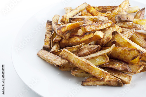 Fried potatoes on a white plate