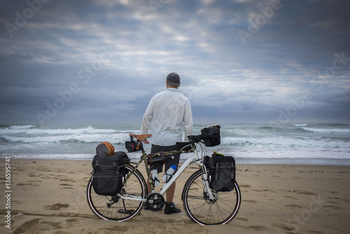Long Distance Cyclist on beach with Bicycle © jfjacobsz