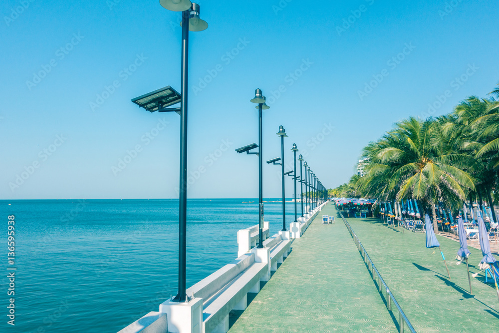 Seaside Blue Clear Sky Background and coconut palm tree beautiful view for relax or promenade.