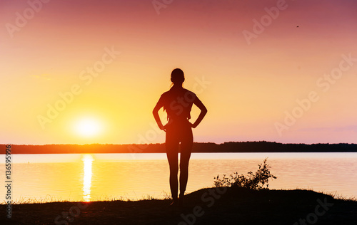 girl at sunset by the lake