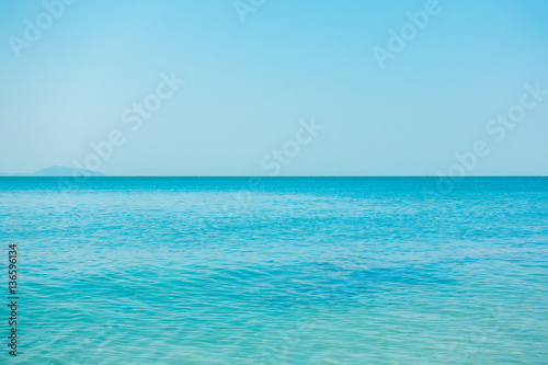 Calm Sea Ocean And Blue Clear Sky Background.