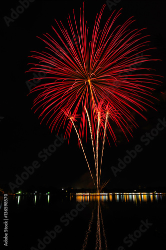 colorful fireworks on the river black sky