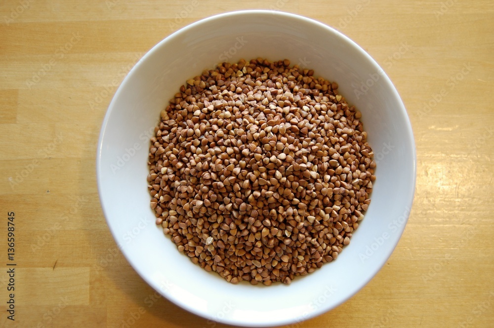 detail of buckwheat in a ceramic white bowl detail of buckwheat in a ceramic white bowl