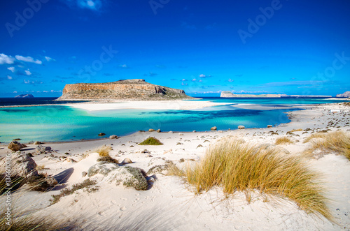 Amazing panorama of Balos Lagoon with magical turquoise waters, lagoons, tropical beaches of pure white sand and Gramvousa island on Crete, Greece