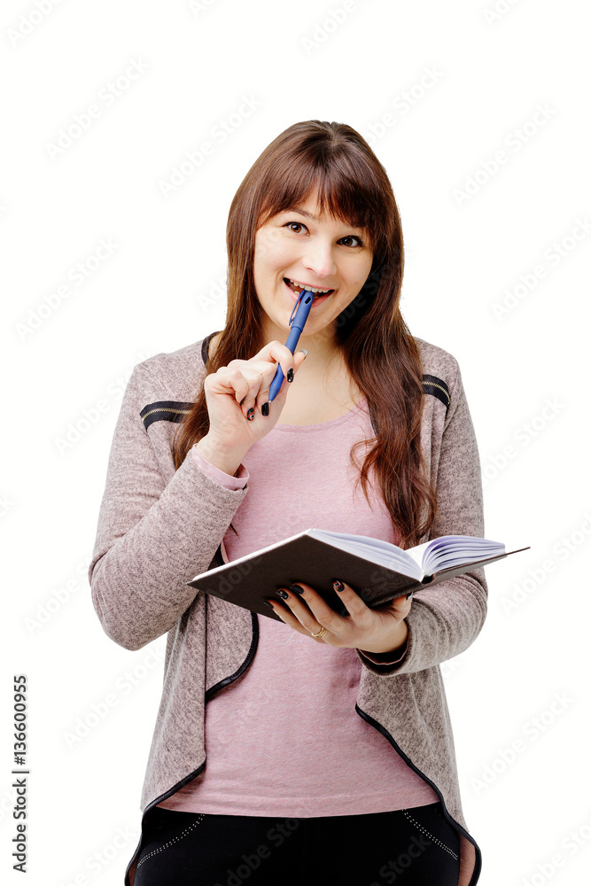 young brunette woman holding a notebook and pen on white isolated background young brunette woman holding a notebook and pen on white isolated background