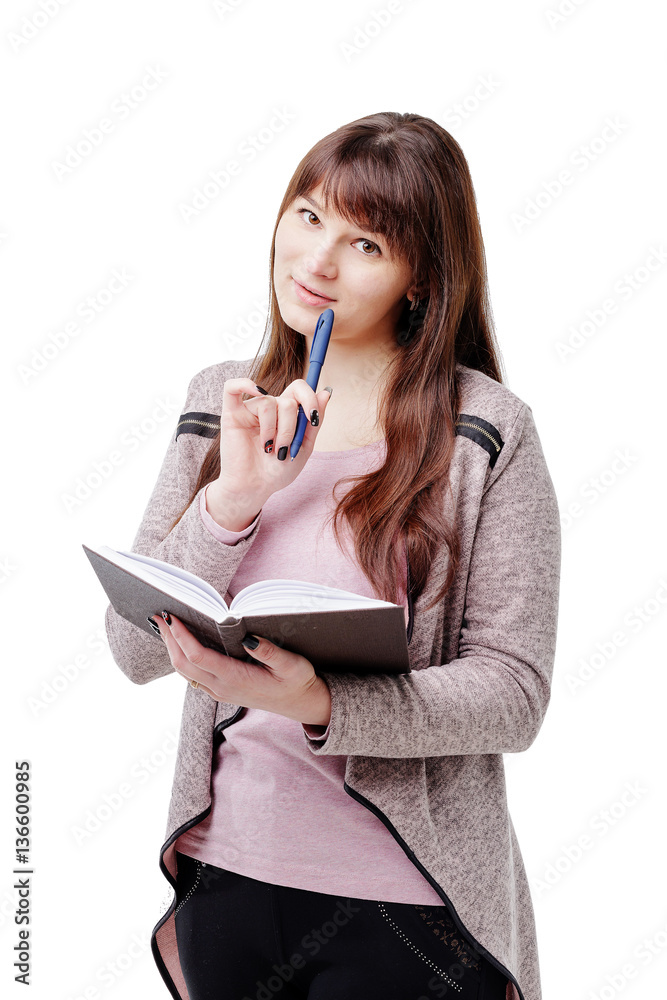 young brunette woman holding a notebook and pen on white isolated background young brunette woman holding a notebook and pen on white isolated background
