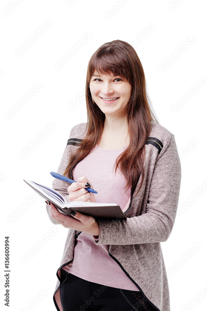 young brunette woman holding a notebook and pen on white isolated background young brunette woman holding a notebook and pen on white isolated background