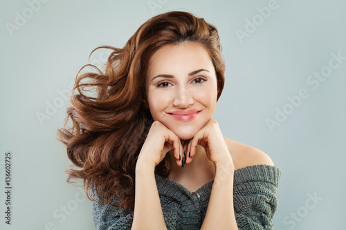 Smiling Woman with Red Curly Hair. Happy Redhead Model