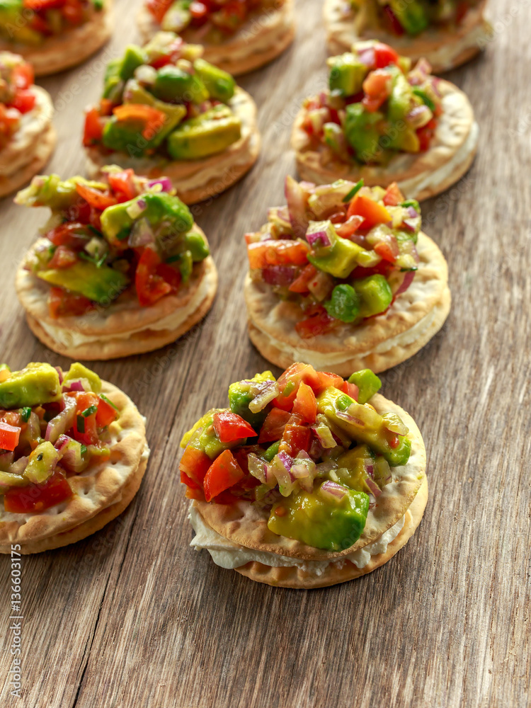Salsa canape cracker appetizers with soft cheese Salsa canape cracker appetizers with soft cheese