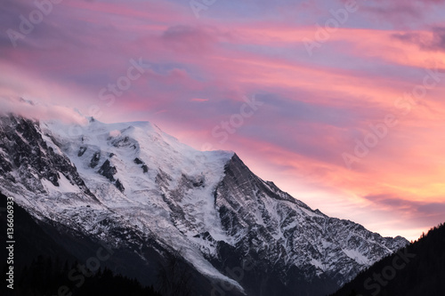 Cloud cover over Massif Mont Blanc illumated by sunset photo