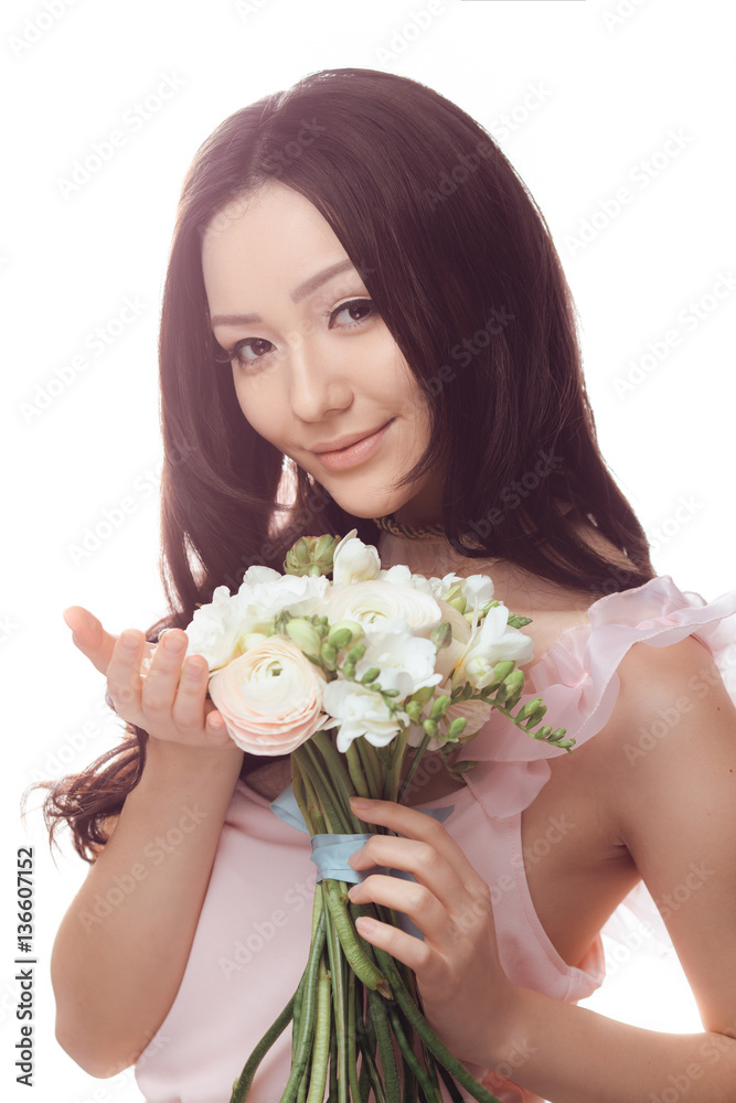 Beautiful asian woman in white dress with bouquet of flowers in hands Beautiful asian woman in white dress with bouquet of flowers in hands