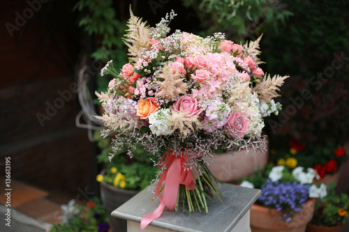Beautiful designer bouquet of roses hydrangeas Astilbe limoneum matiola