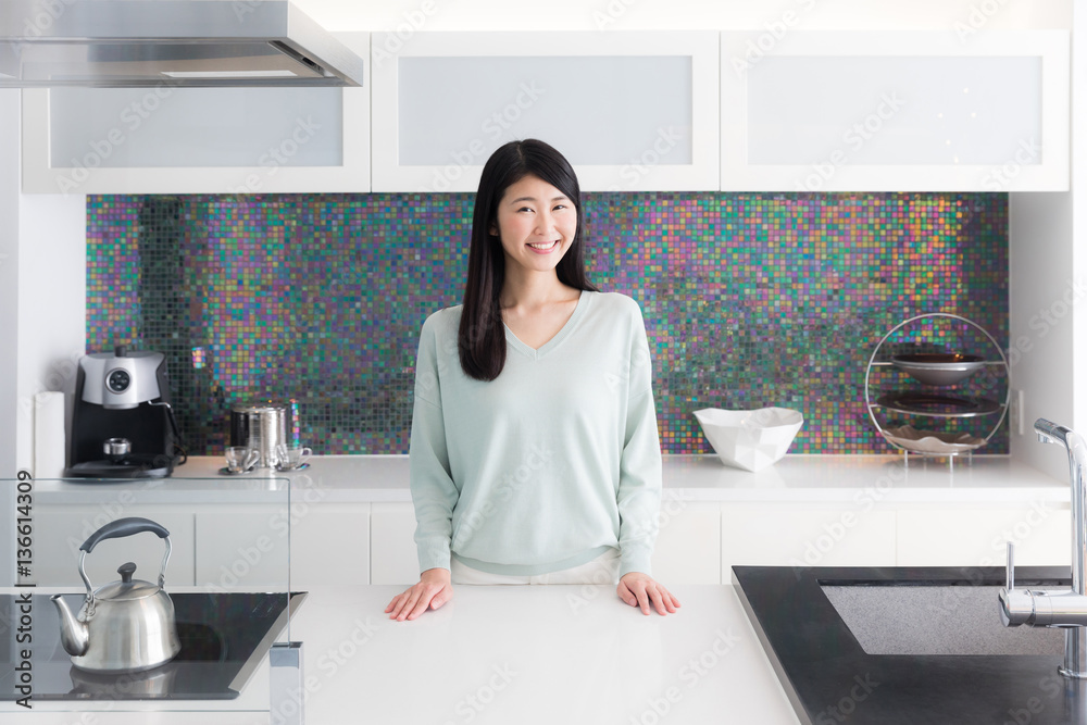 portrait of attractive asian woman in the kitchen portrait of attractive asian woman in the kitchen