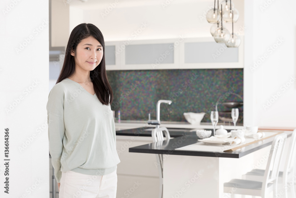 portrait of attractive asian woman in the kitchen portrait of attractive asian woman in the kitchen