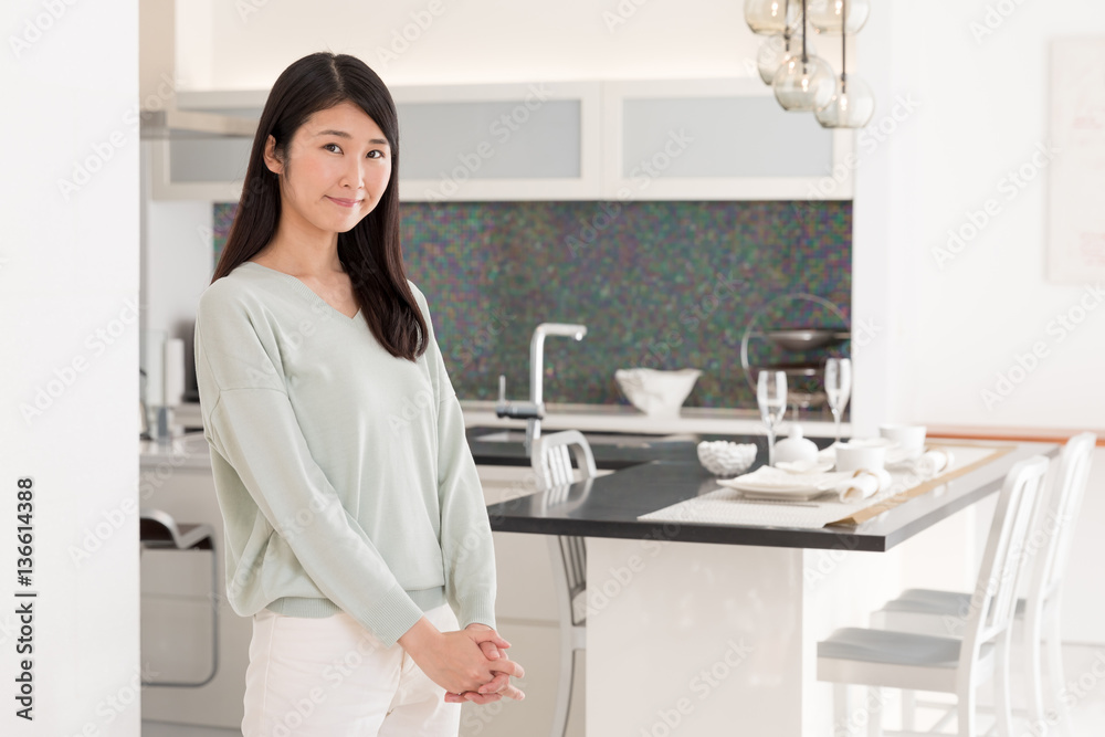 portrait of attractive asian woman in the kitchen portrait of attractive asian woman in the kitchen