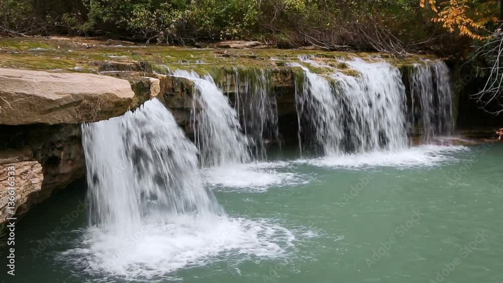 Albert Falls, a small plunging waterfall on the North Fork of West Virginia's Blackwater River splashes into a colorful pool in this seamlessly looping video.