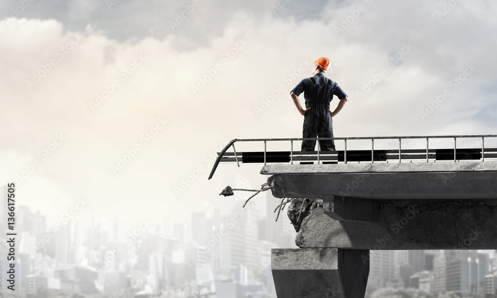 Engineer man against industrial background . Mixed media Engineer man against industrial background . Mixed media
