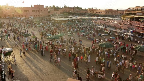Summer time ,since their home is so warm, peoples of Marrakesh come and spend their night time in Djemma El Fna square which is taken into UNESCO heritage program. photo