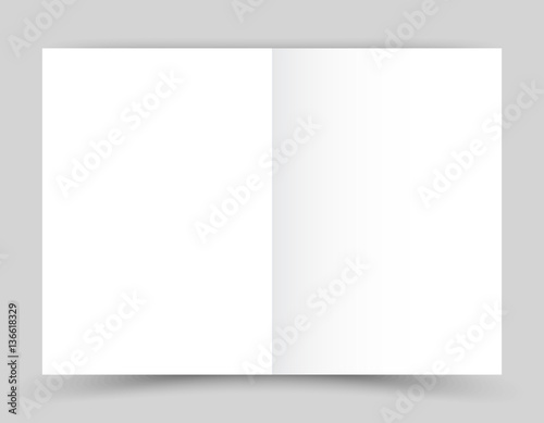 White stationery: blank twofold paper brochure on gray background. photo