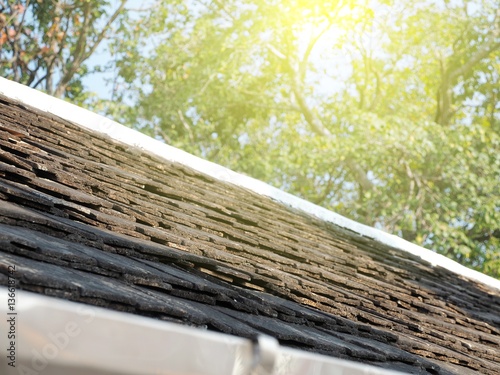 Old wooden roof tile on house