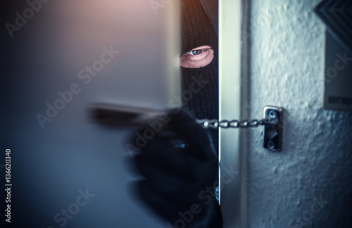 burglar open door of apartment or house photo