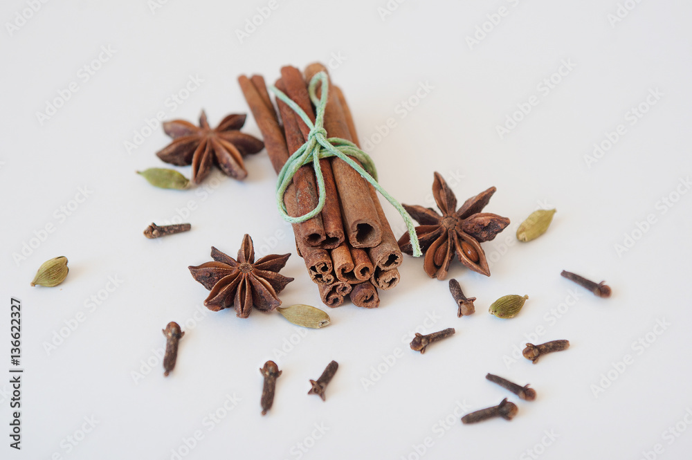 Set of cinnamon, clove and star anise on white background. Close up Set of cinnamon, clove and star anise on white background. Close up