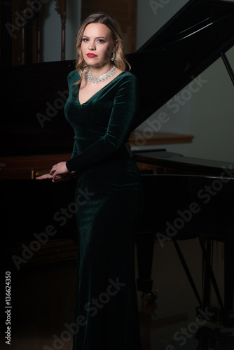 Portrait of Beautiful Woman With the Piano