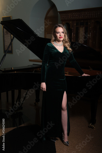 Portrait of Beautiful Woman With the Piano